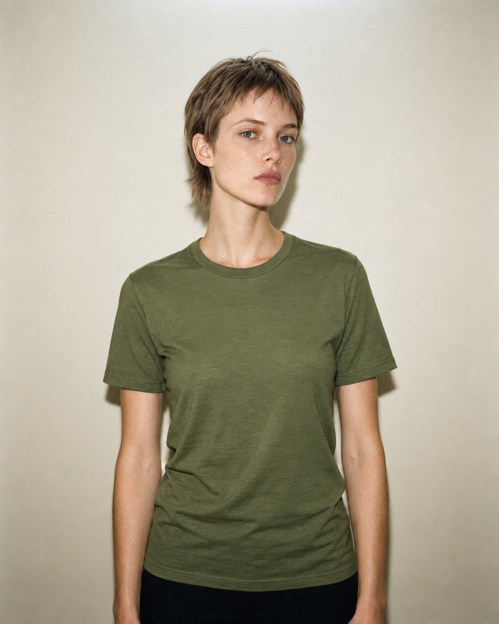 Model wearing the women's Moss Tea Mello Blend T-shirt, straight front view